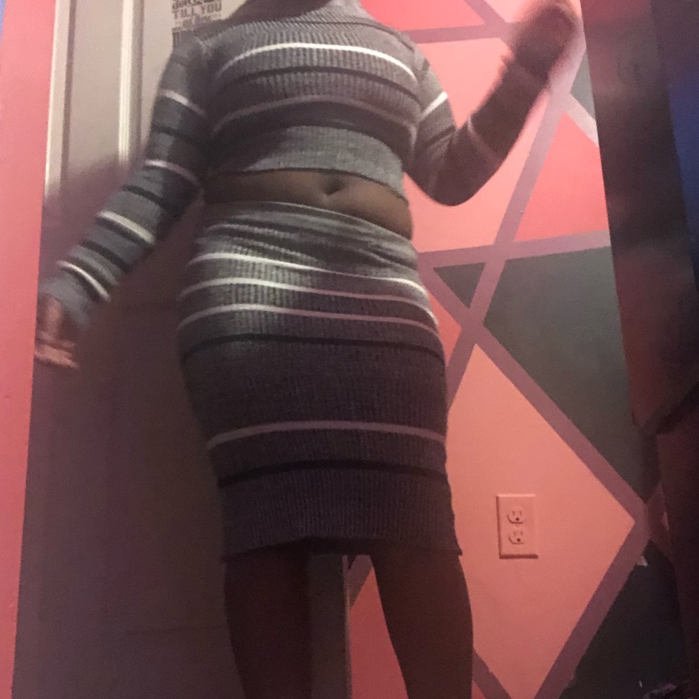 I’m selling a grey black and white sweater skirt.